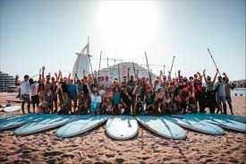 SHORE THING SURF THERAPY MARKS WORLD MENTAL HEALTH DAY WITH GIANT COMMUNITY PADDLE OUT